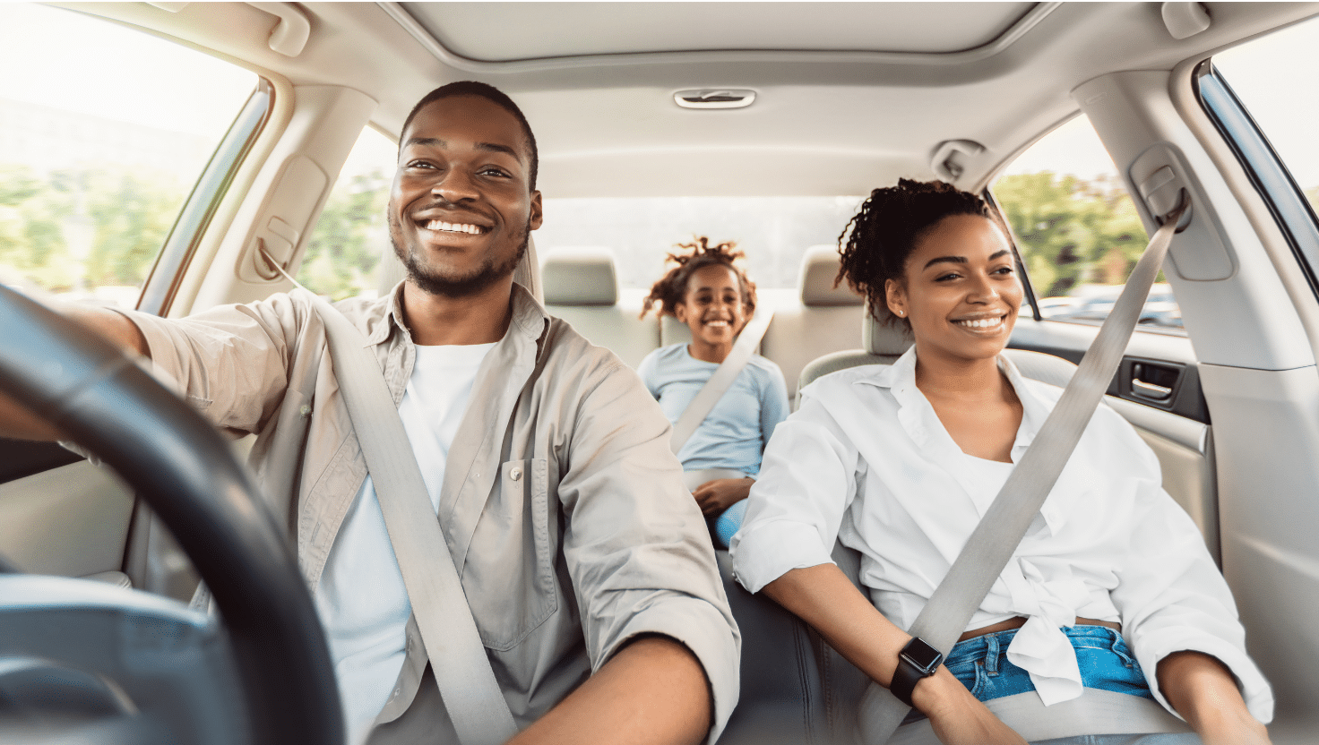 Family drives off in a new car after trading their old one in at Weelee.