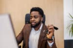 A man uploads his car details easily on the Weelee platform to sell his car online.