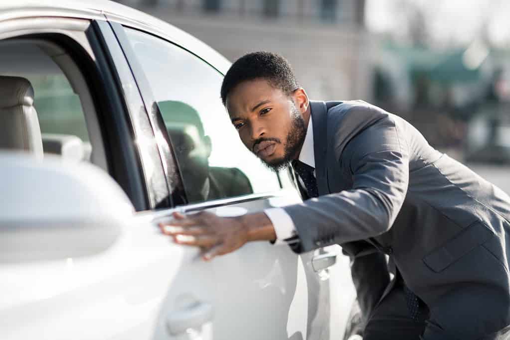 Carefully examine the paintwork of a used car for sale