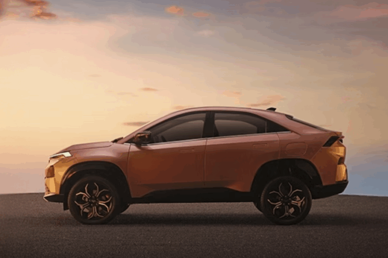 ATA Curvv's distinctive coupe-SUV silhouette, highlighting its aerodynamic design and high ground clearance against a dramatic sky.