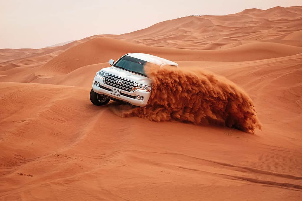 Toyota Land Cruiser Prado drives over sand dunes with ease