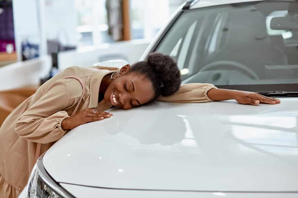 Woman is excited to buy a quality used car