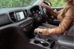 Woman test drives a used automatic car for sale