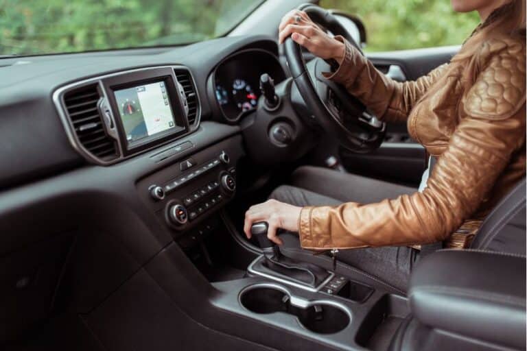 Woman test drives a used automatic car for sale