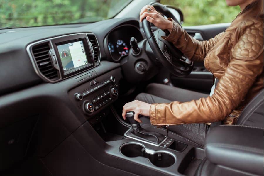 Woman test drives a used automatic car for sale