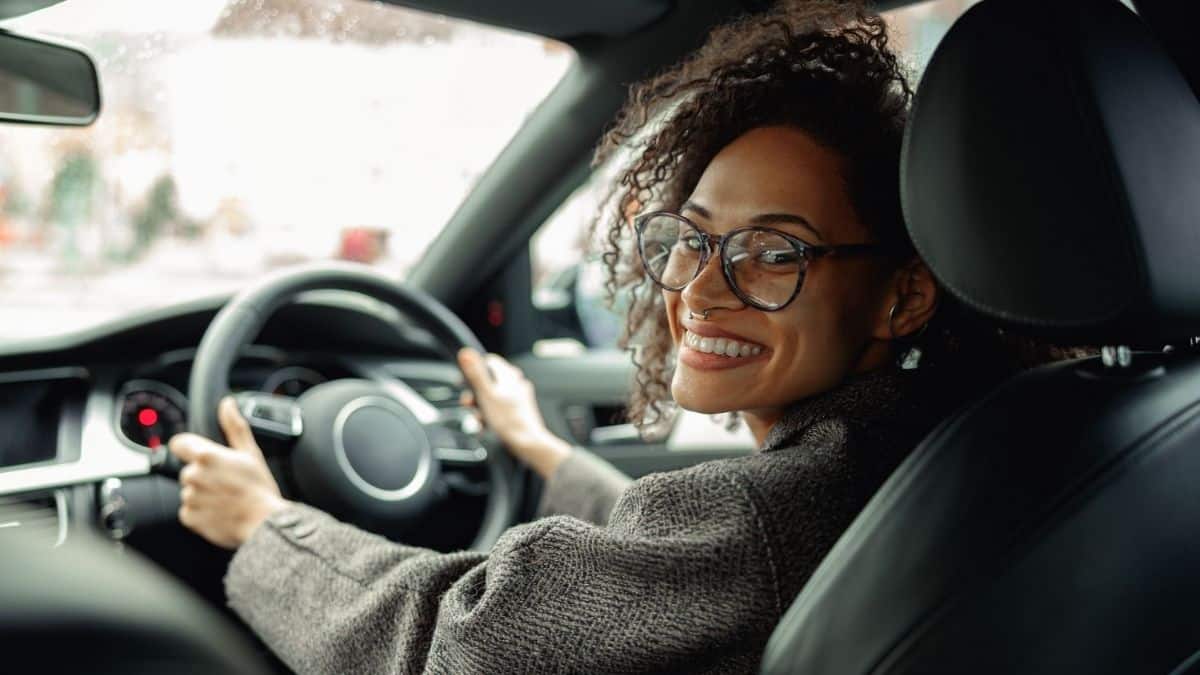 Woman test drives a used fuel car