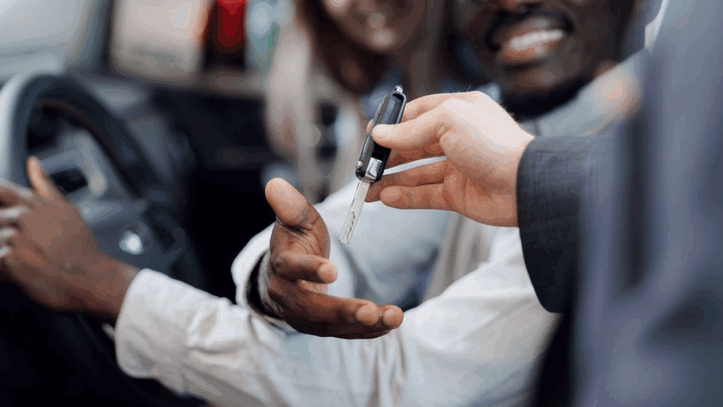 Person hands over car keys